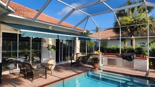 Pool with patio and awning