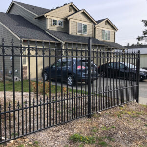galvanized steel fence and house