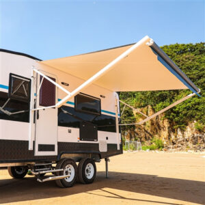 RV with awning on the beach