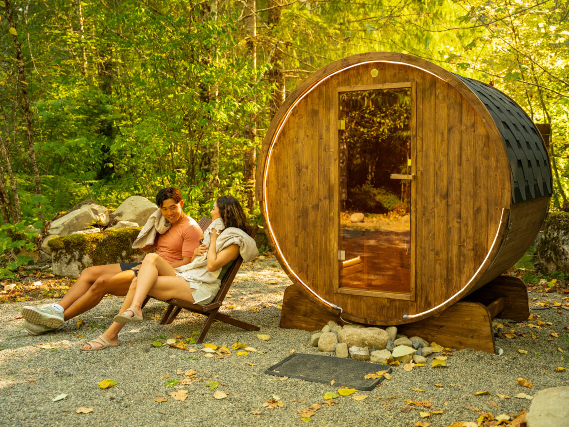 Sauna with two people sitting next to it.