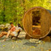 Sauna with two people sitting next to it.